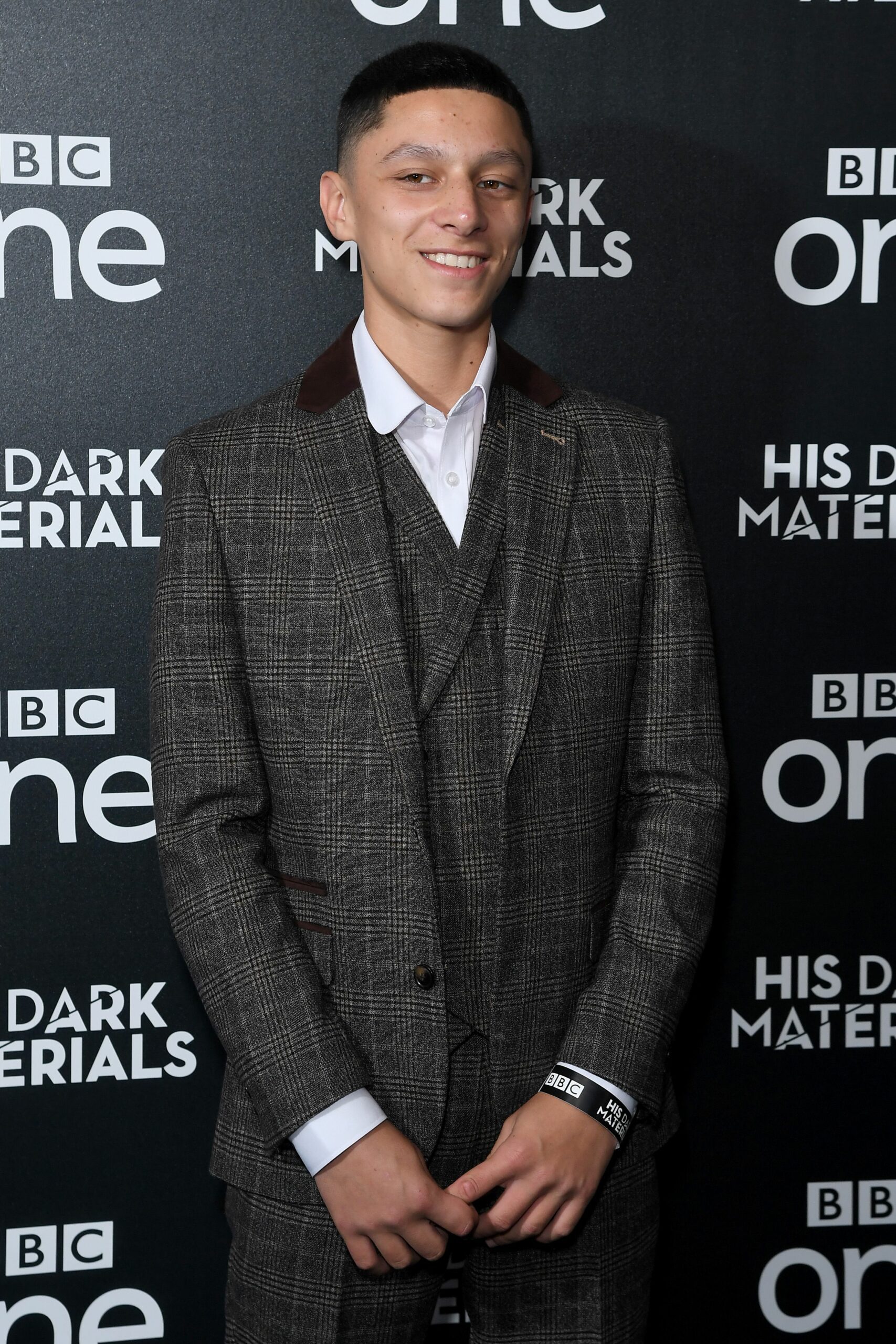 Daniel Frogmore smiling in a suit