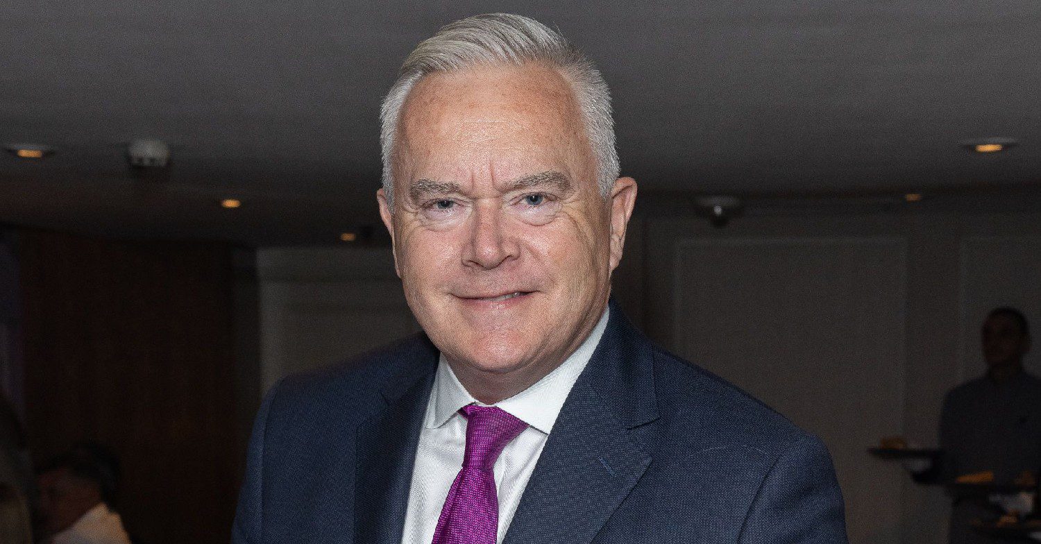 Huw Edwards smiling at event