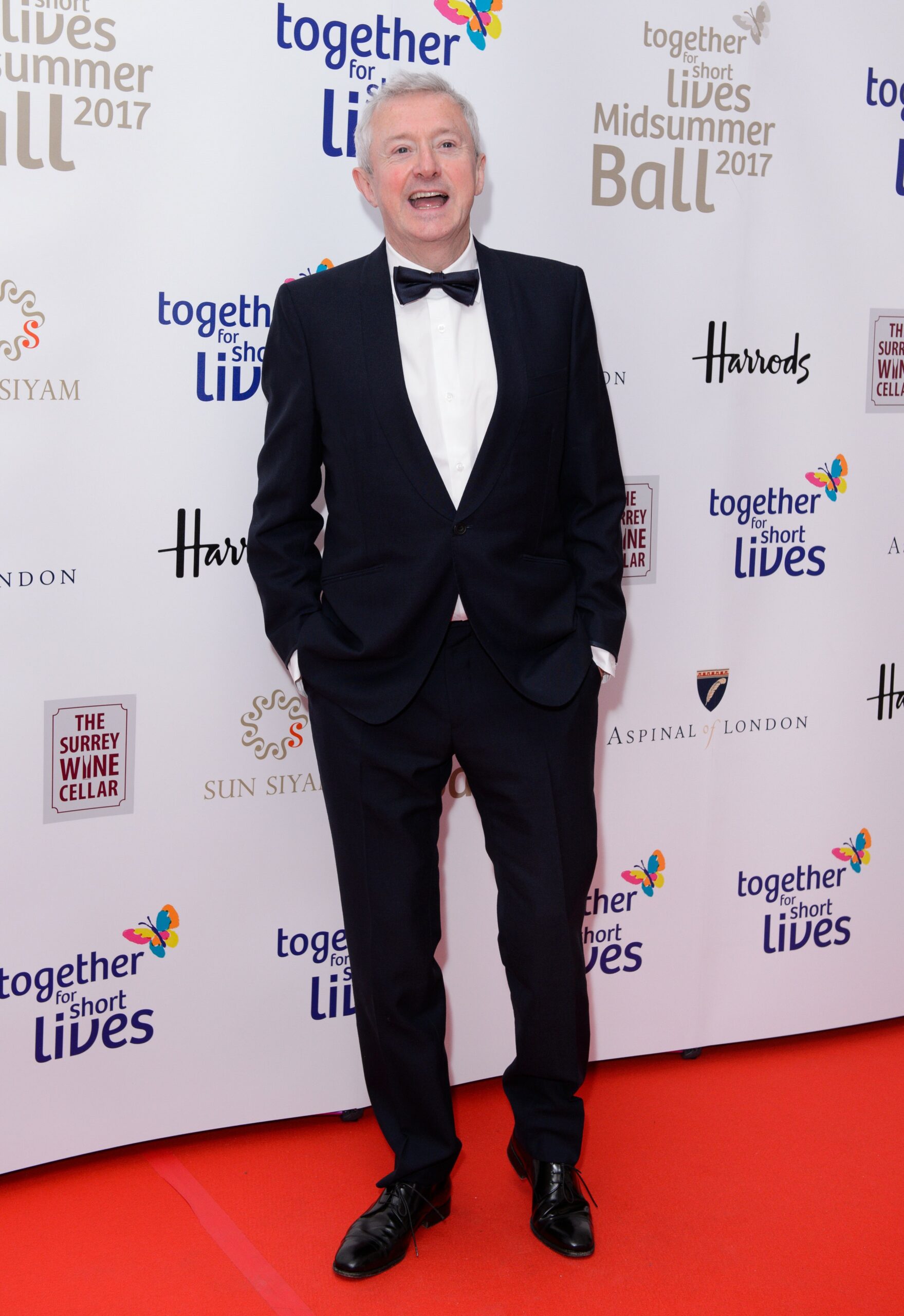 Louis Walsh smiling at event
