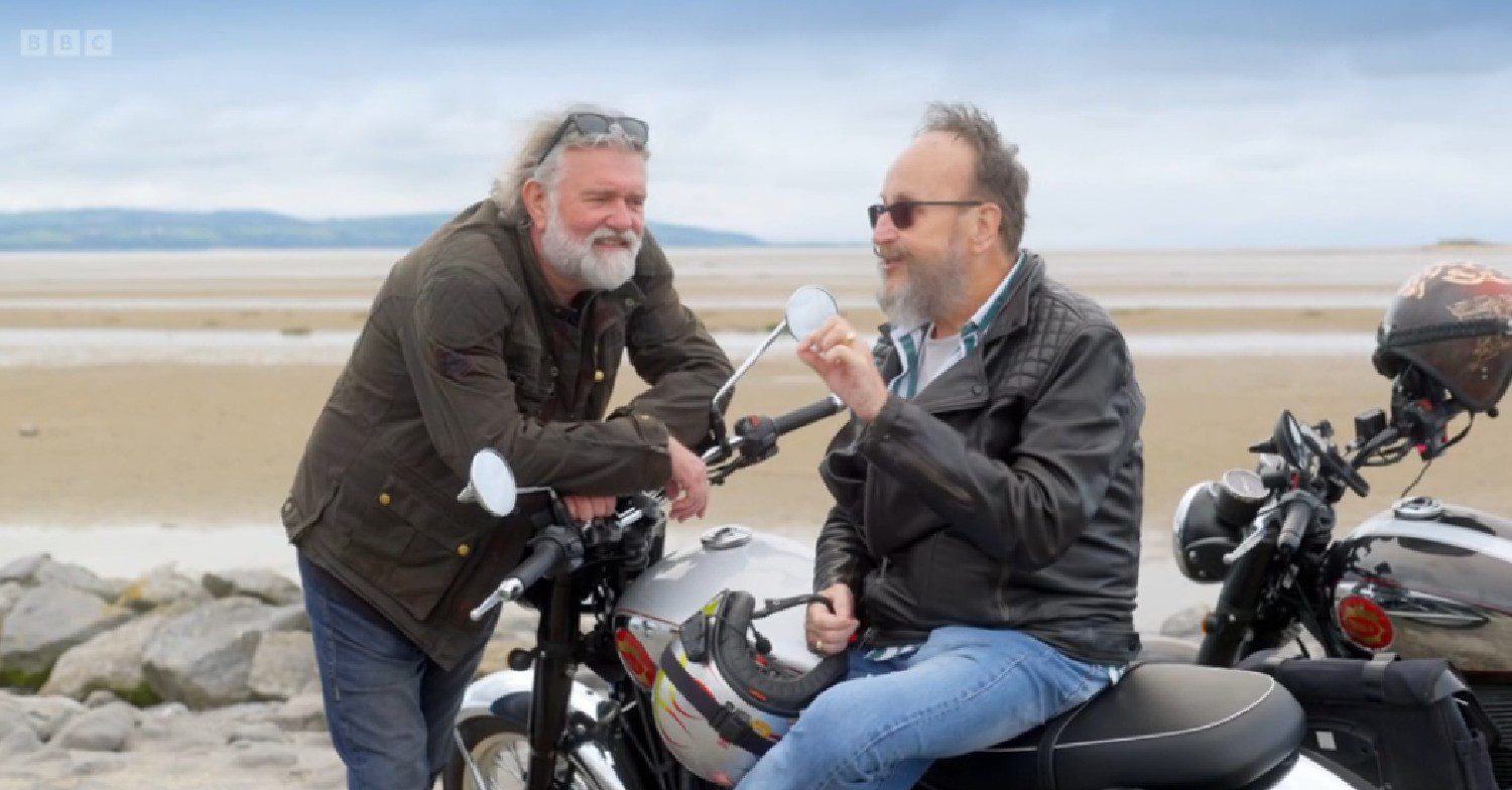 Si King and Dave Myers leaning on bikes on The Hairy Bikers Go West