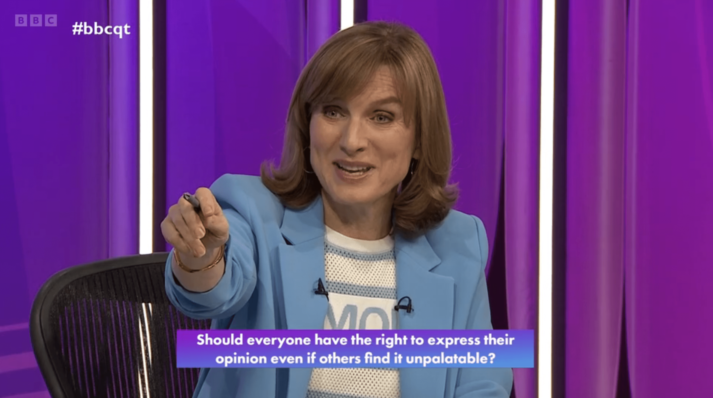Fiona Bruce pointing at audience on Question Time wearing a blue blazer