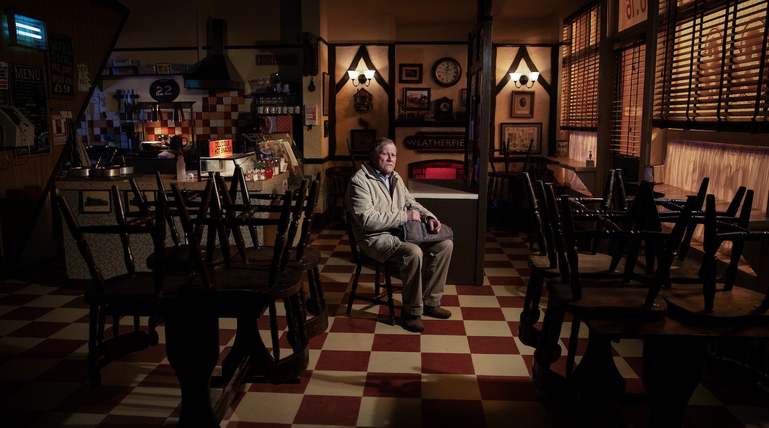 Roy Cropper in Corrie sits alone in the dark cafe