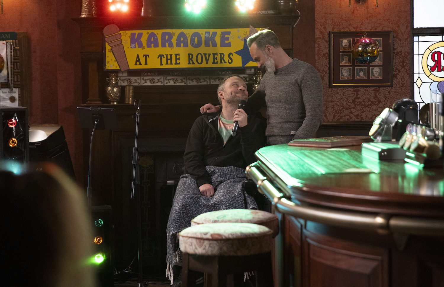 Paul Foreman and Billy Mayhew gaze at each other as they sing karaoke in the Rovers