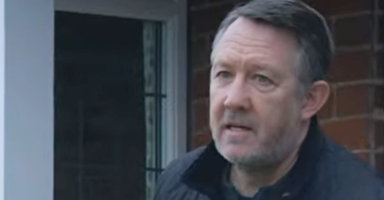 Emmerdale's Gus is serious outside of his house