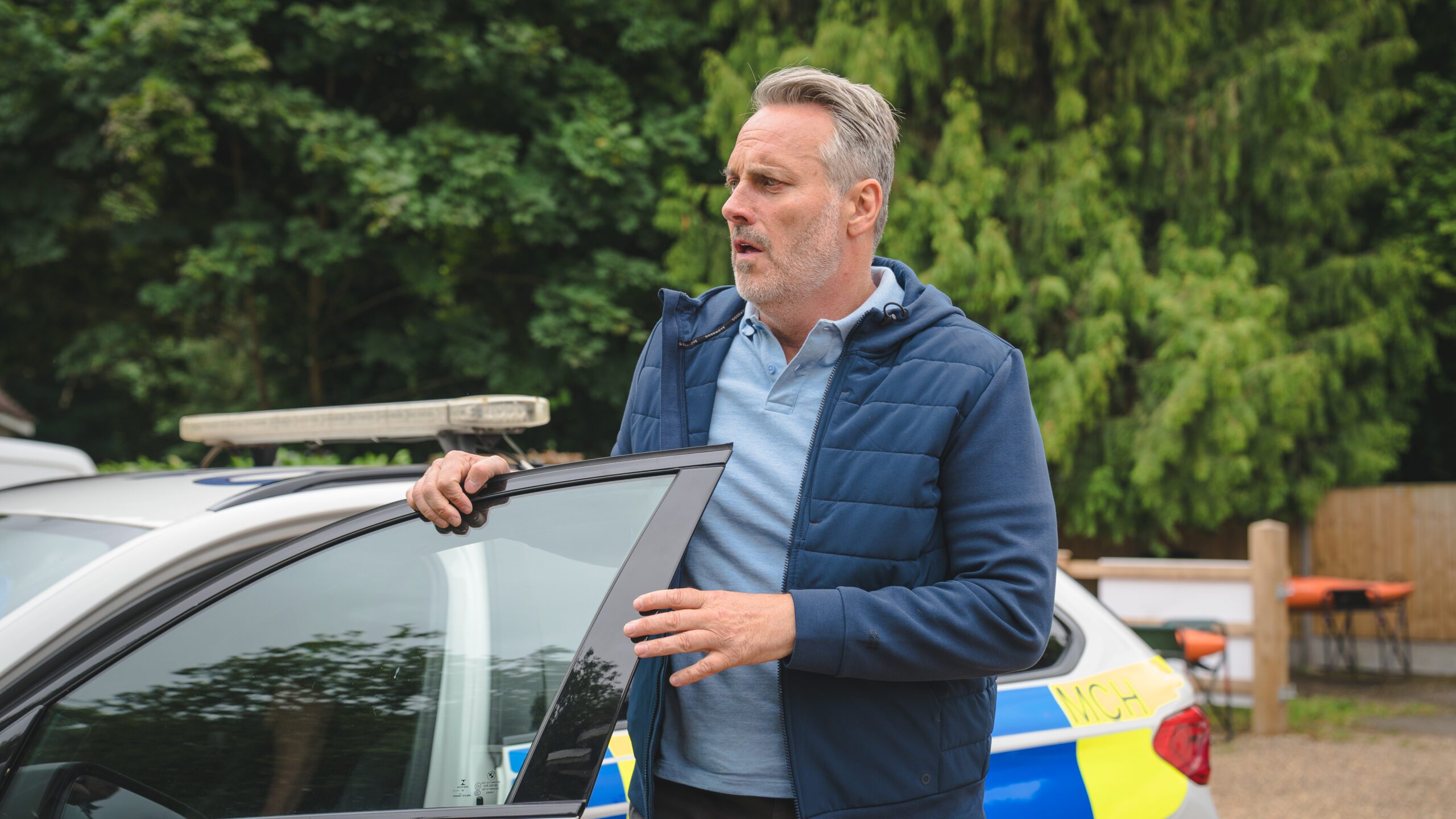 Mark Frost getting out of a car in The Marlow Murder Club