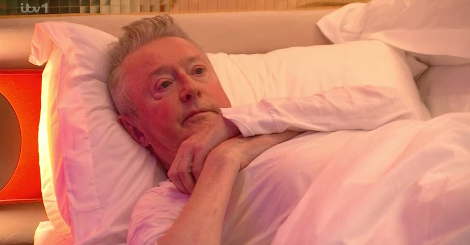 Louis Walsh lays in bed