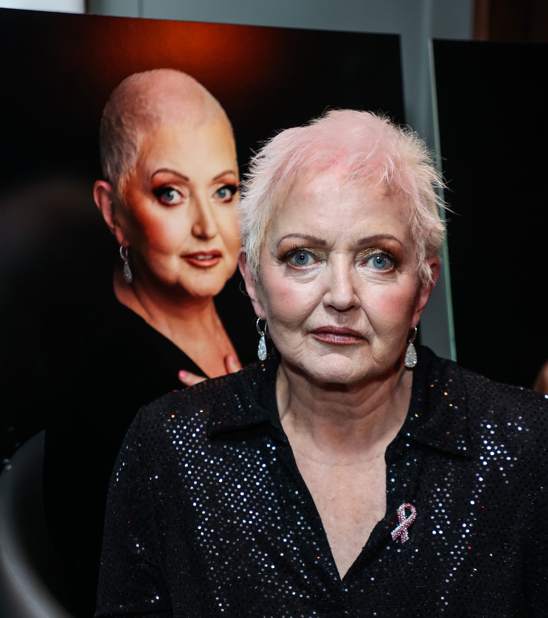 Linda Nolan with a picture of herself taken for a Pink Ribbon campaign