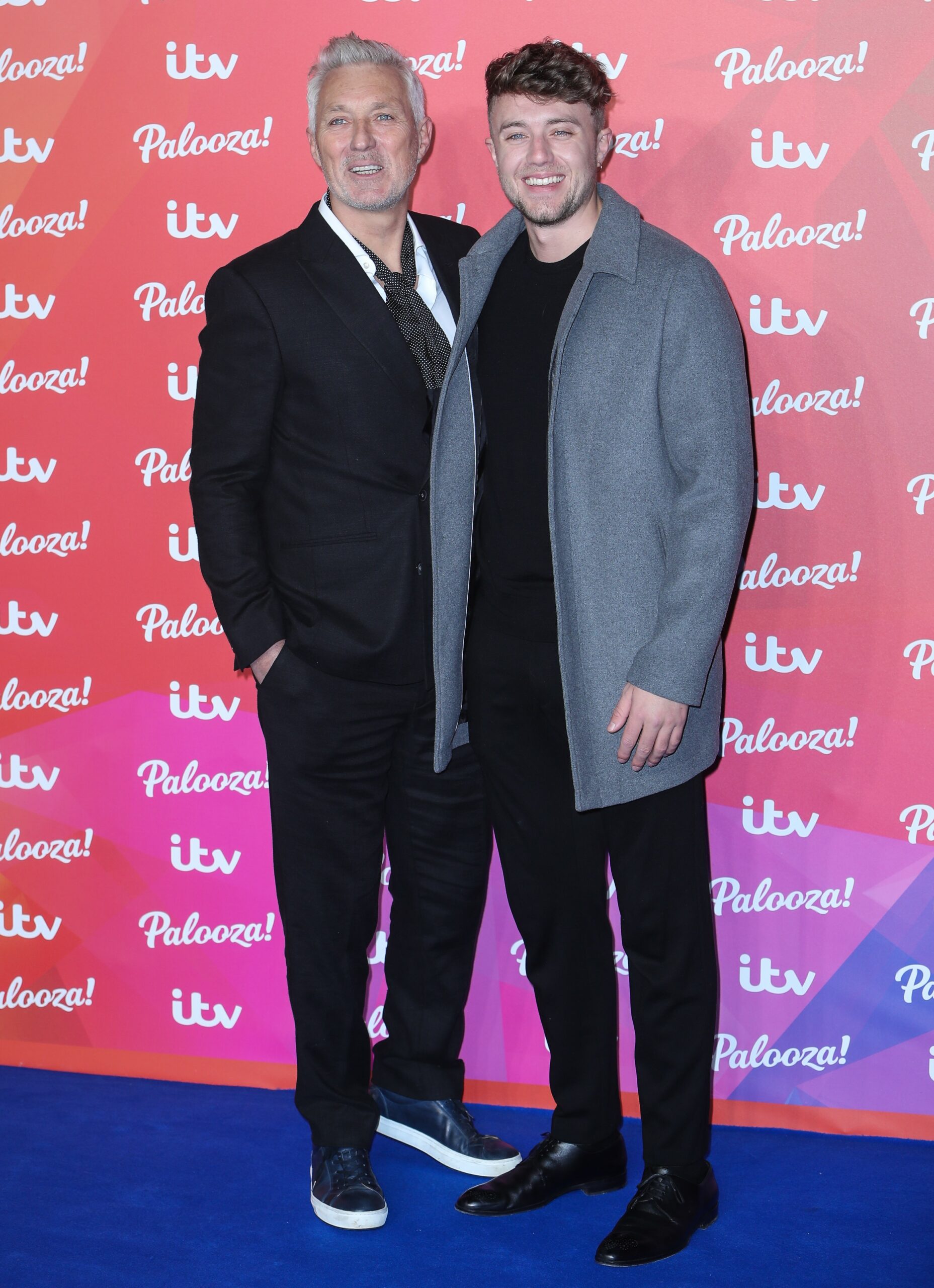 Roman Kemp smiling with his dad Martin at ITV Palooza
