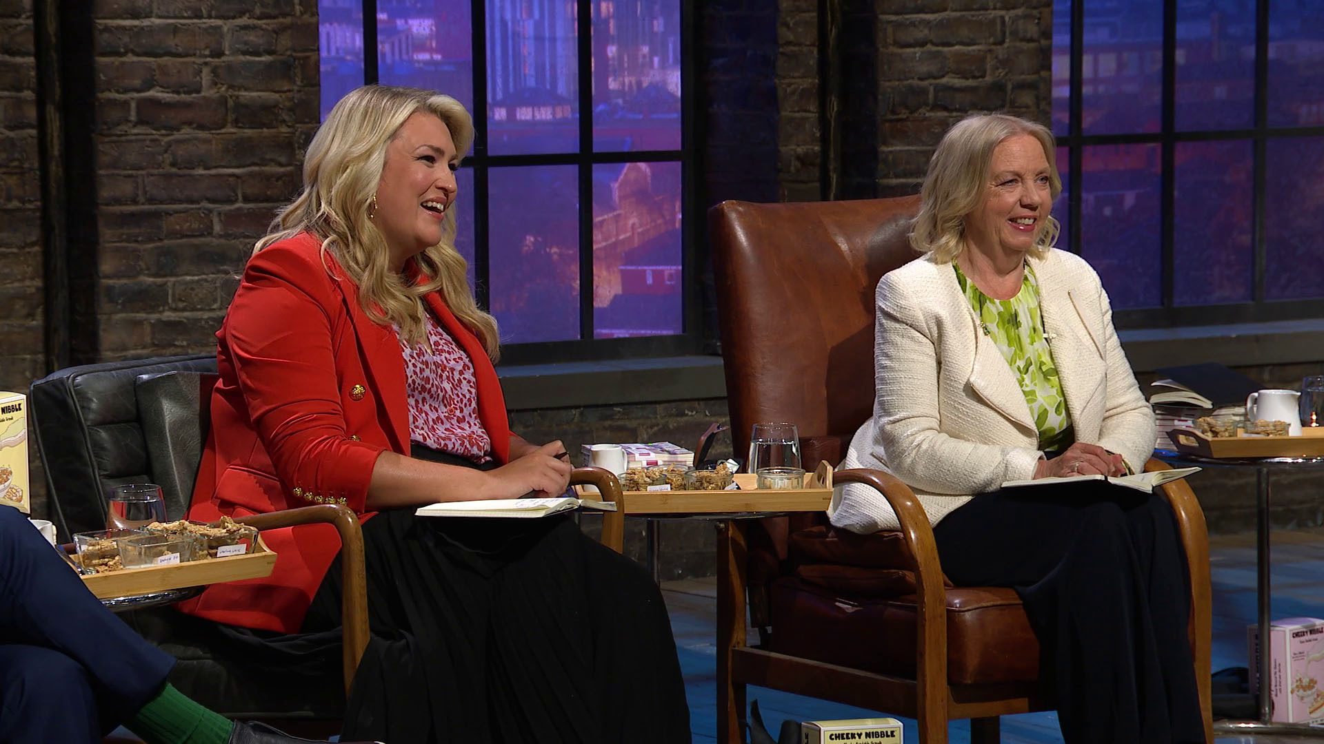 Sara Davies sat with Deborah Meaden both smiling in Dragons' Den series 21 episode 10