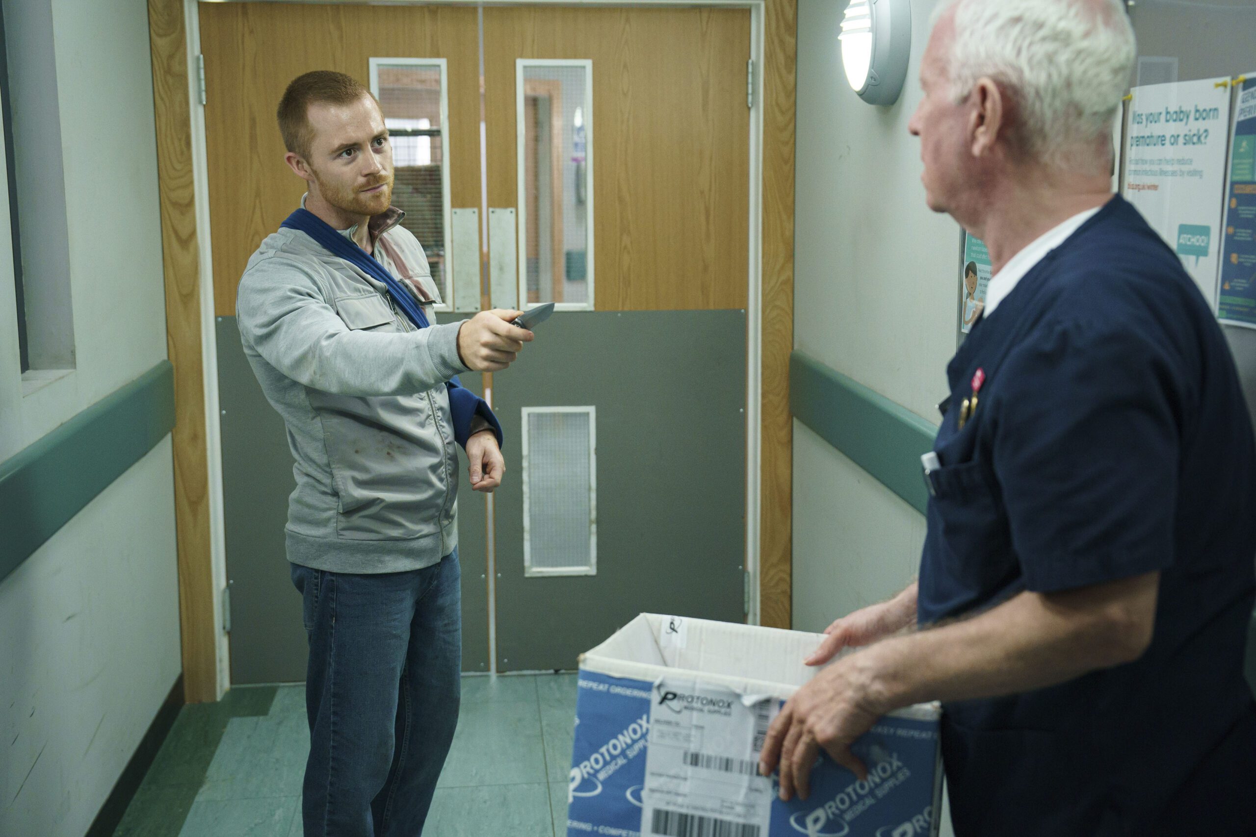 Kyle threatens Charlie with a knife in Casualty