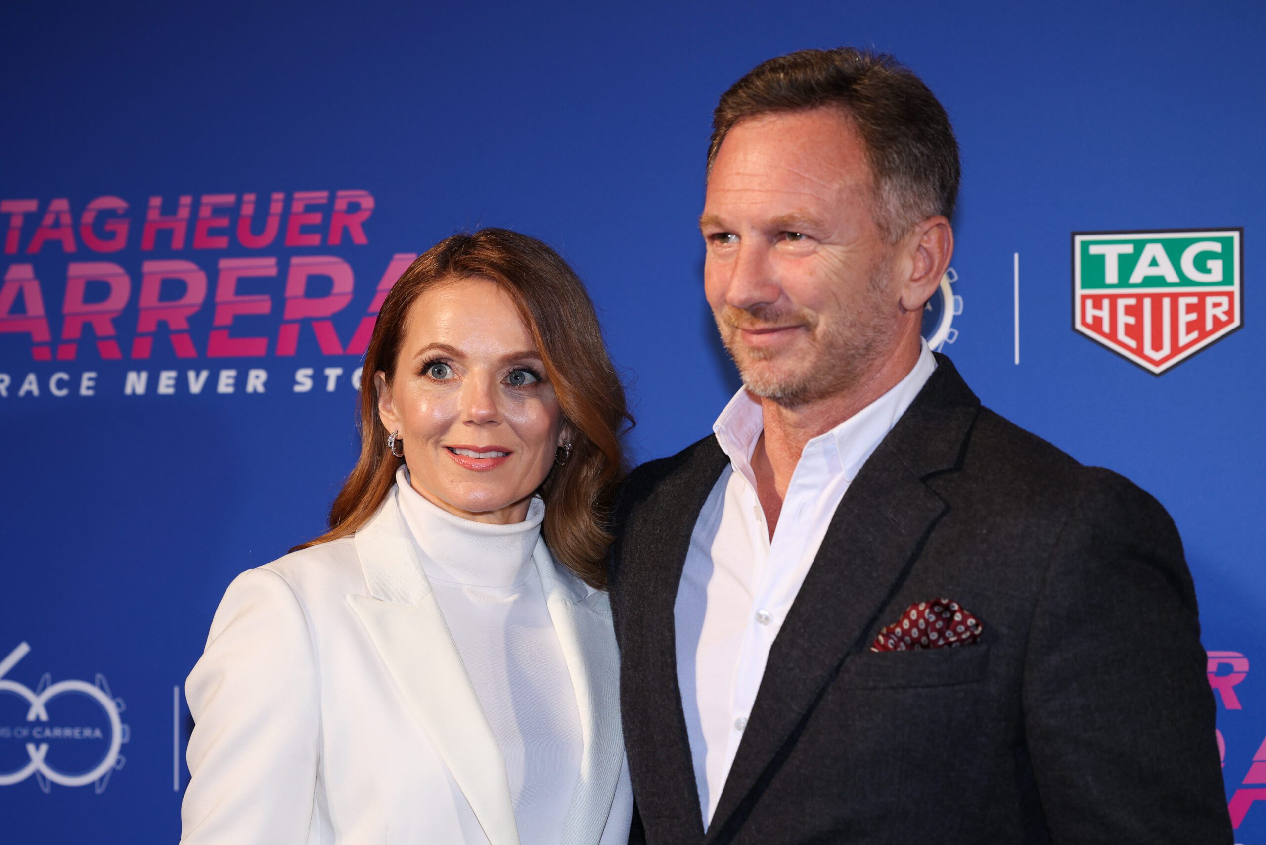 Geri Halliwell with Christian Horner smiling on the red carpet