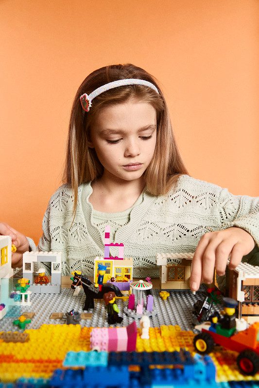 Little girl playing with Lego