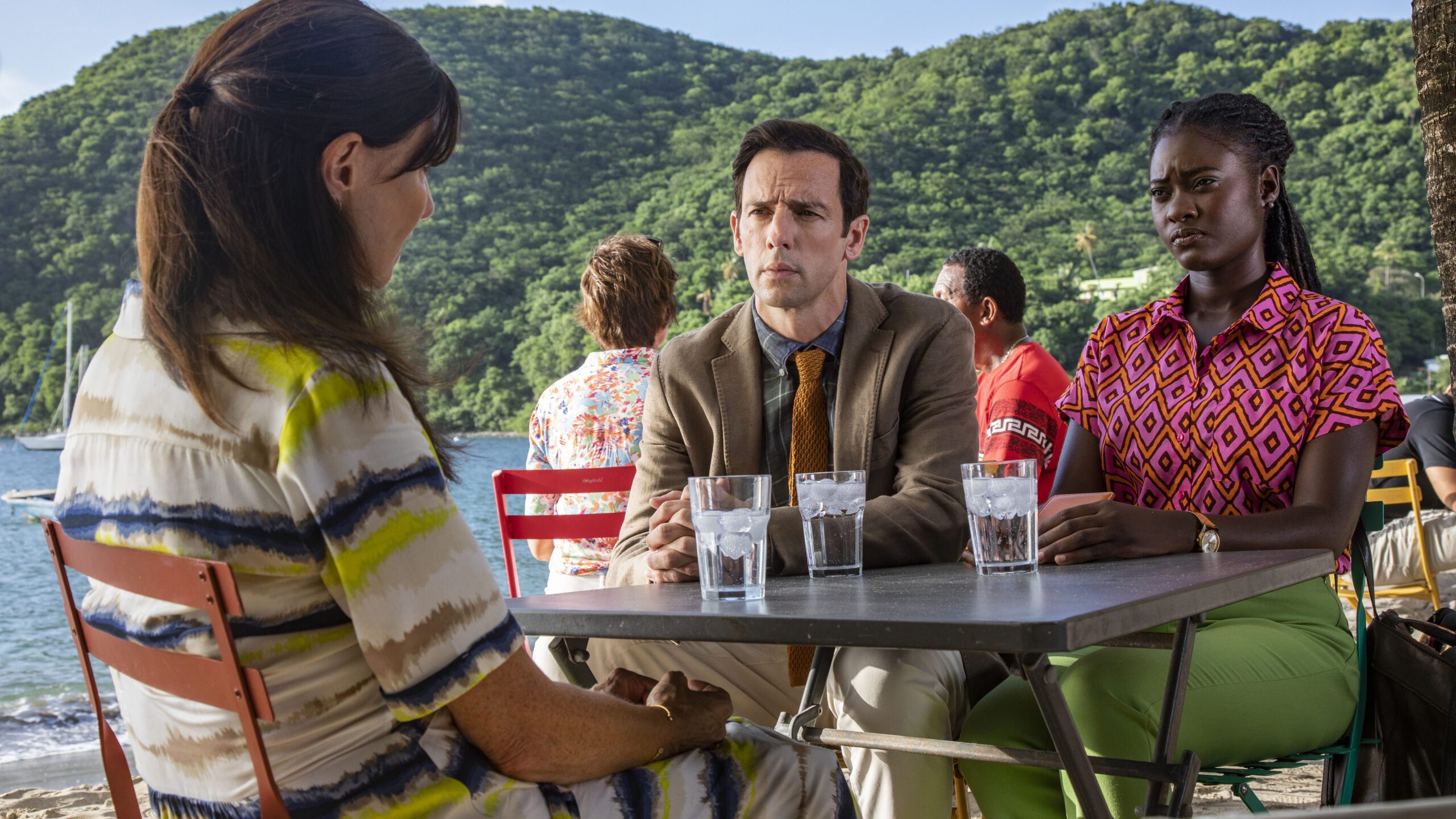 Naomi and Neville interrogate a suspect in Death in Paradise