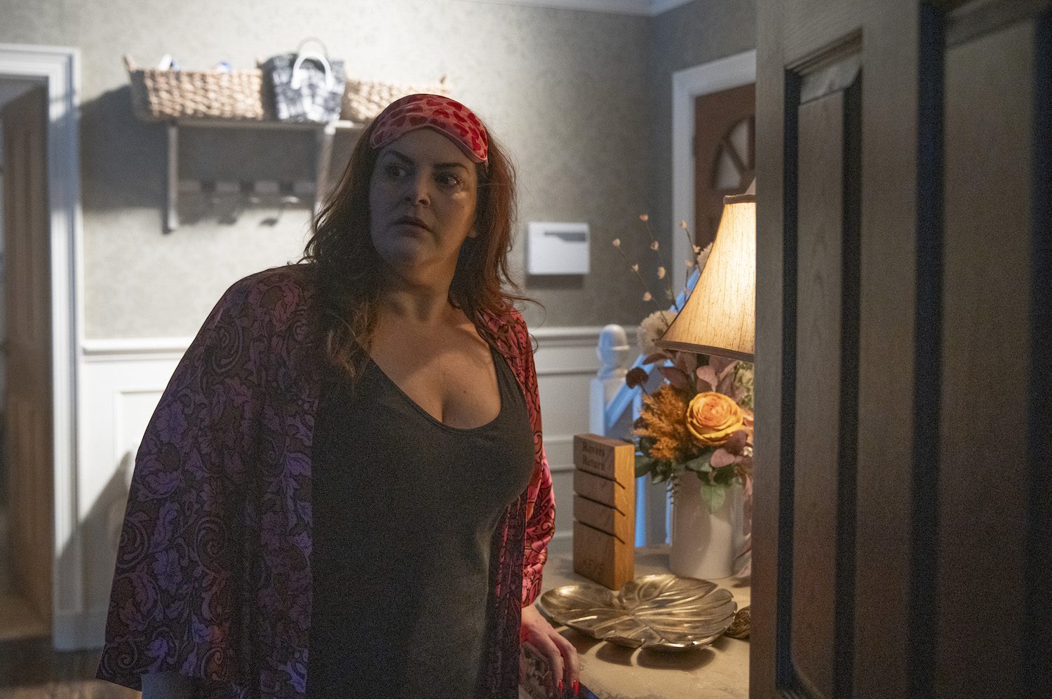 Glenda looking worried in her dressing gown