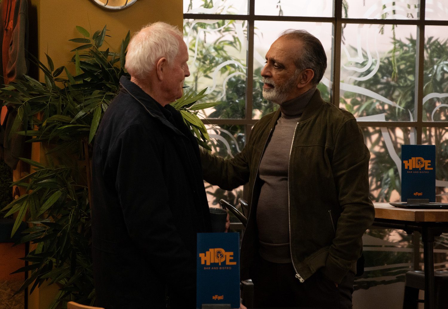 Amit puts his hand on Pollard shoulder as he gives him a cold warning in Emmerdale