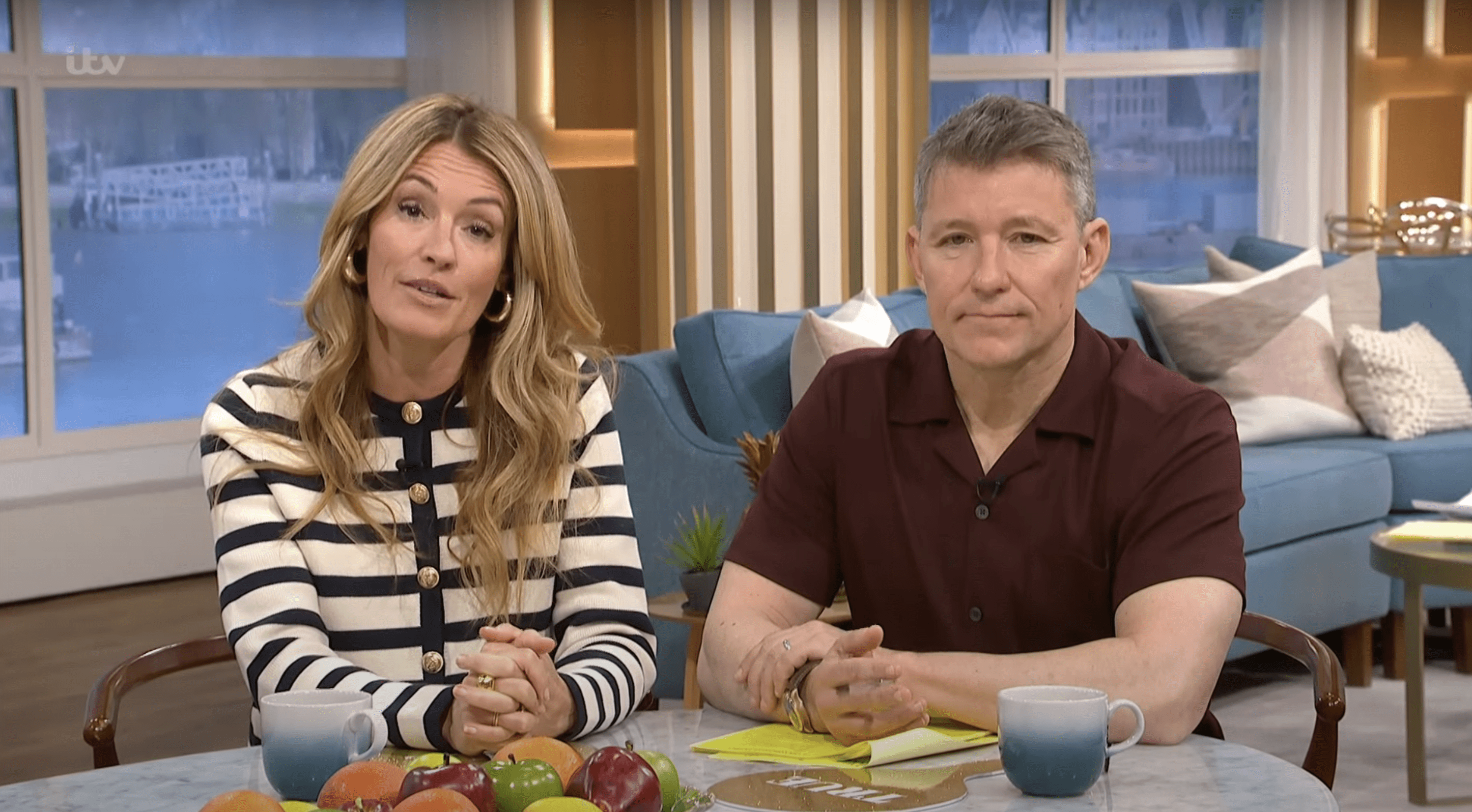 Cat Deeley wearing a stripey jumper alongside Ben Shephard whilst presenting This Morning