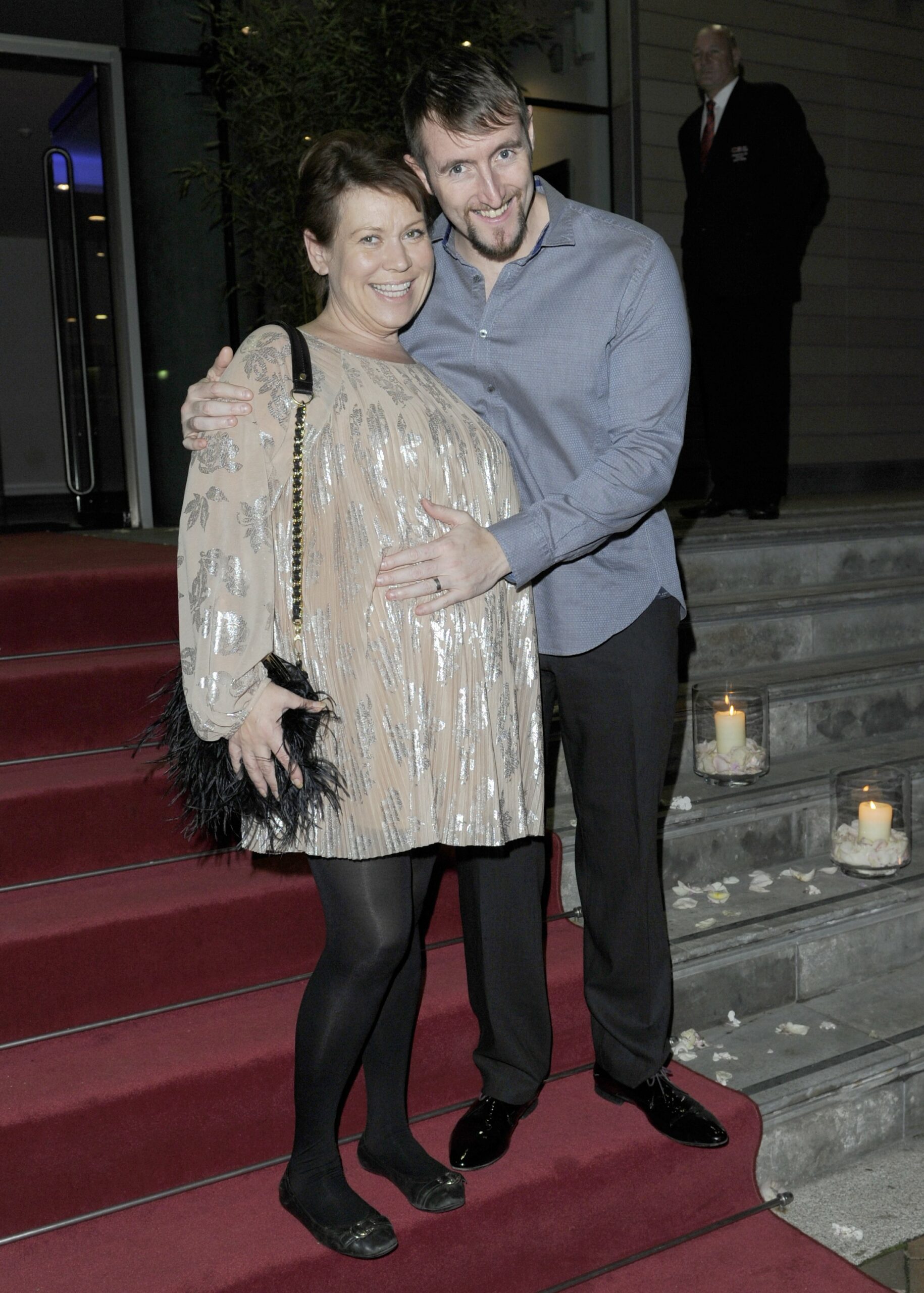 Tina Malone, pregnant, alongside husband Paul Chase at event