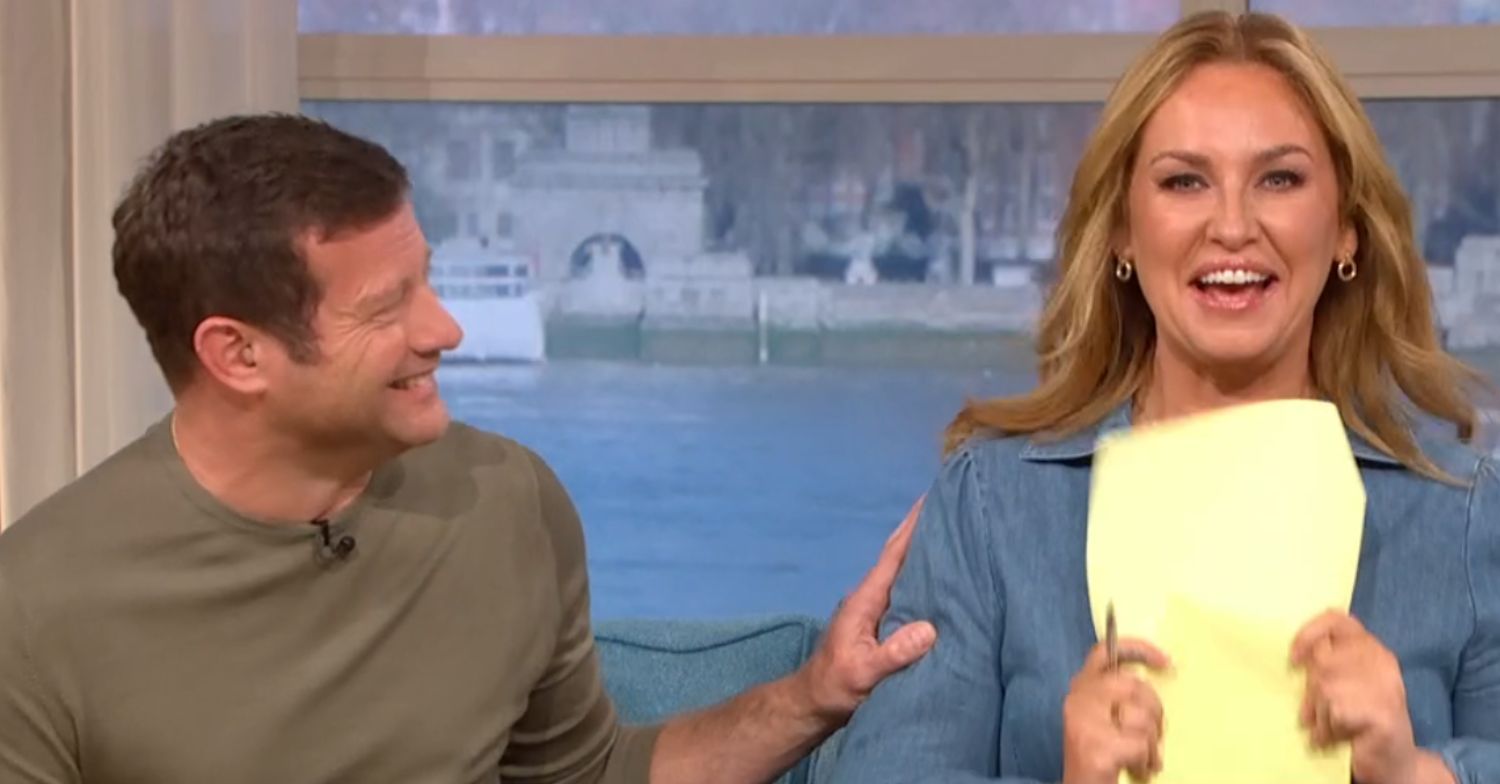 Dermot O'Leary laughing at Josie Gibson while she fans herself 