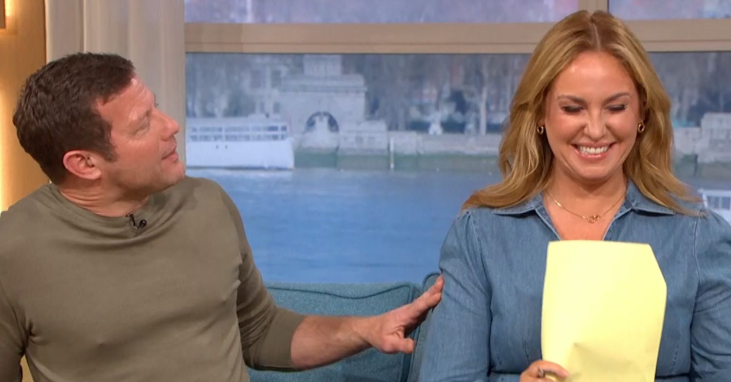 Dermot O'Leary laughing at Josie Gibson while she fans herself 