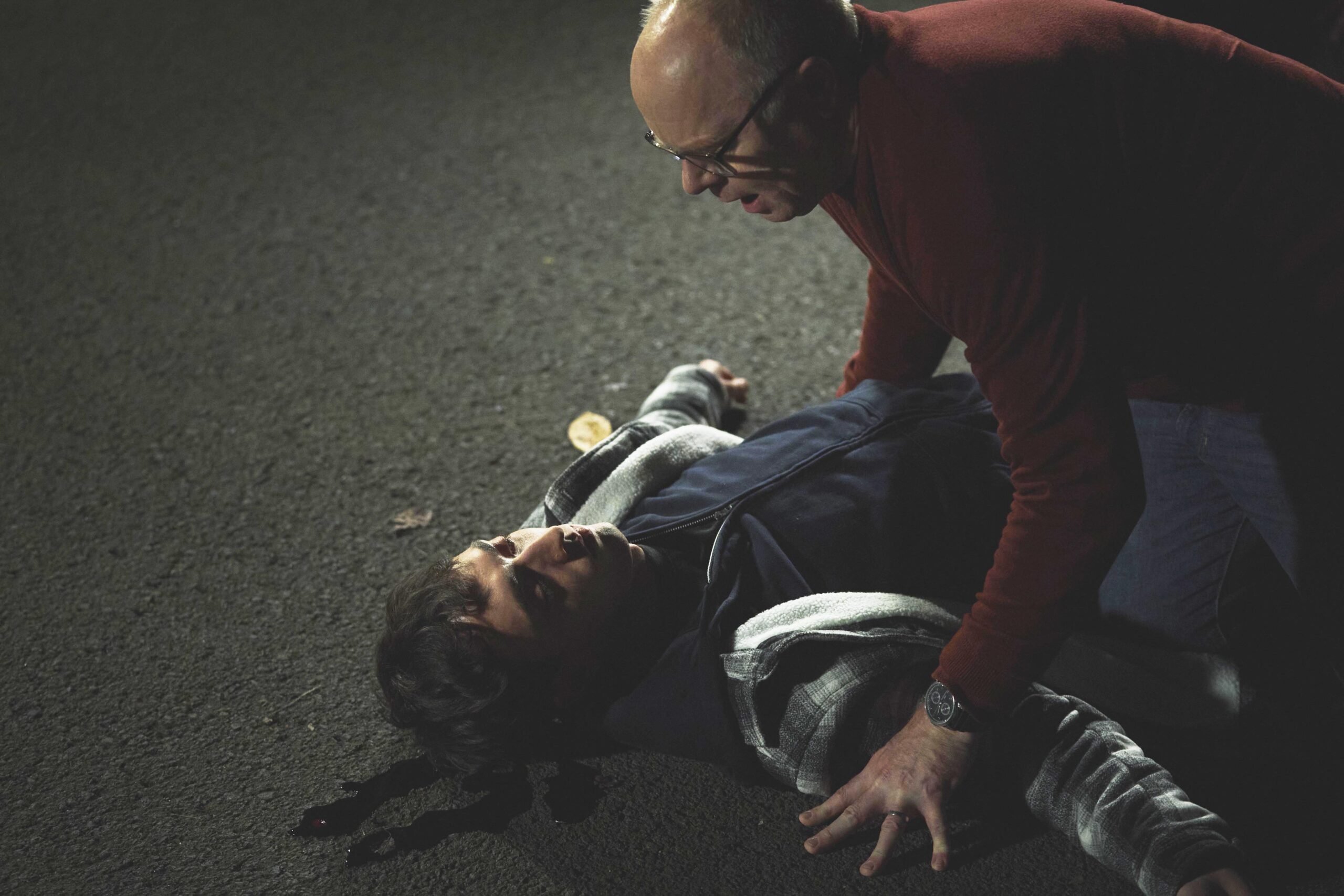 Simon hovers over Jordan's lifeless body