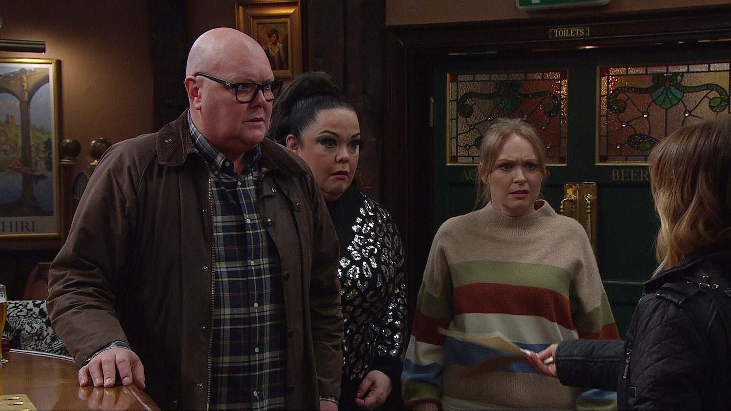 Paddy, Mandy and Vanessa all look shocked as Rhona hands them a letter in Emmerdale spoilers
