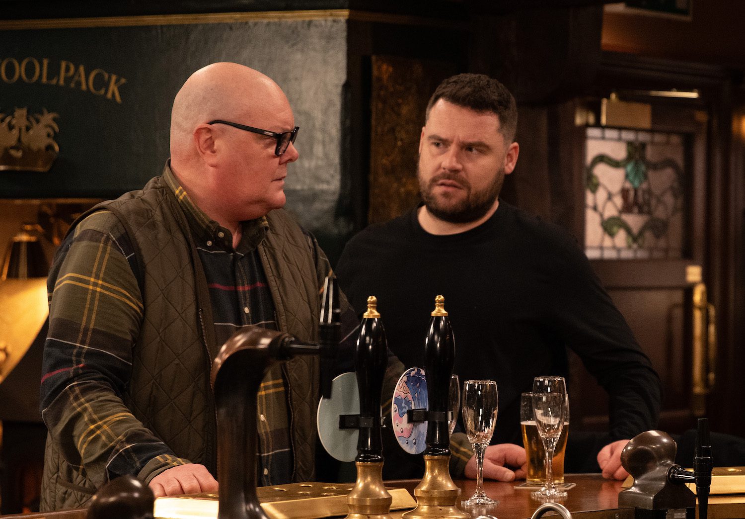 Emmerdale's Paddy and Aaron are talking at the Woolpack bar together