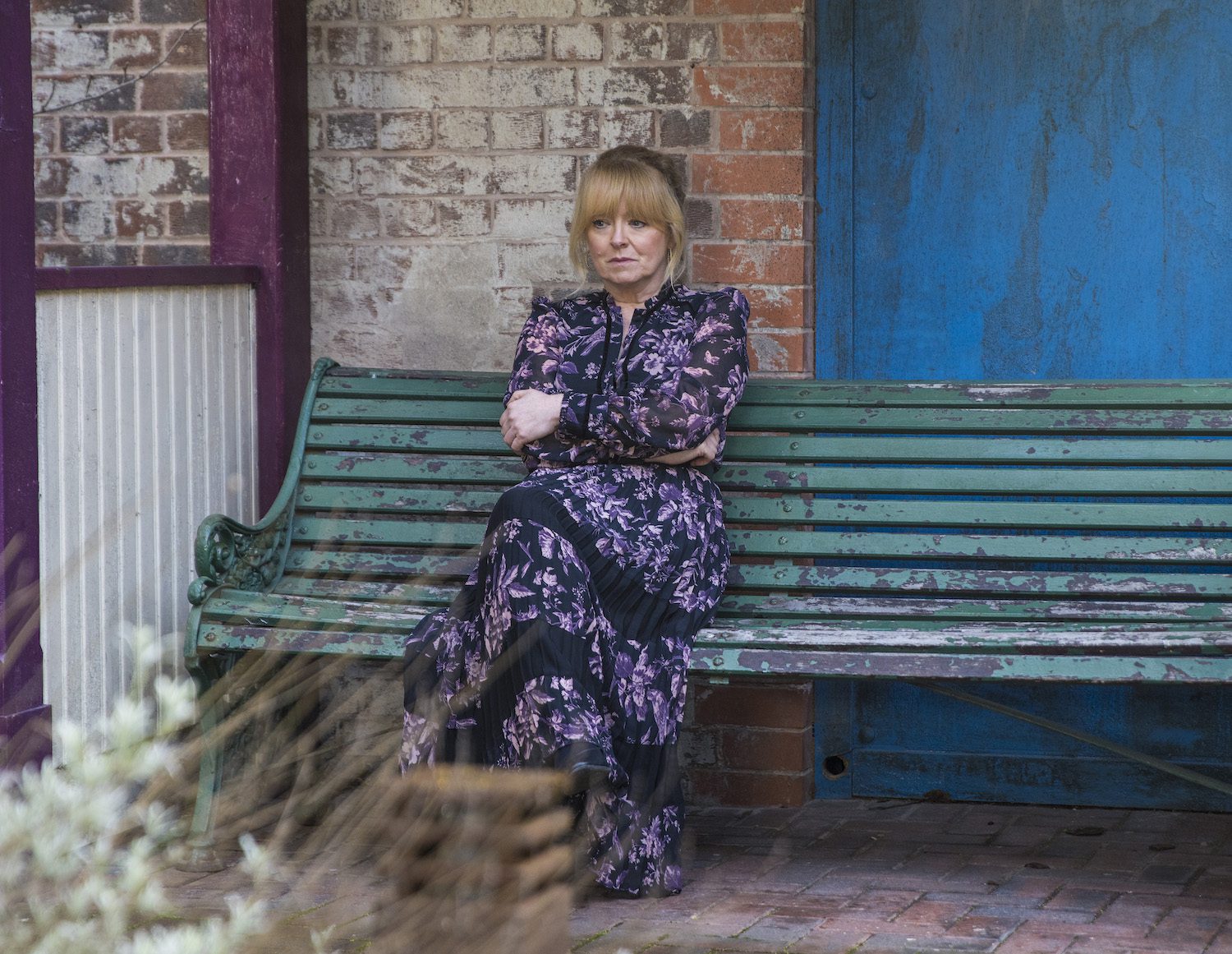 Coronation Street's Jenny is sitting on a bench outside