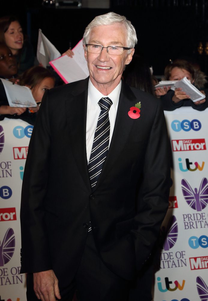 Paul O'Grady smiling on the red carpet