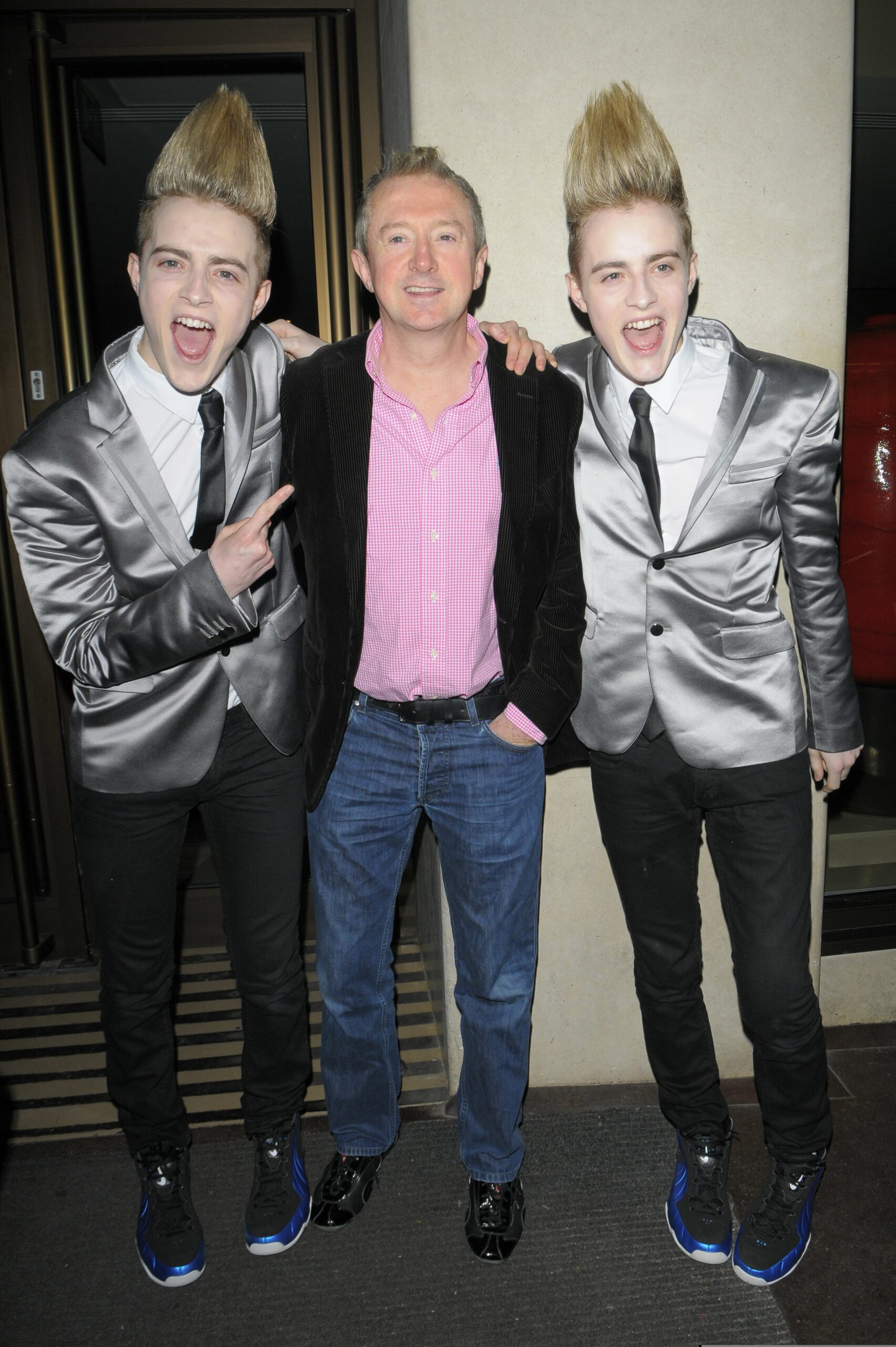 Jedward and Louis Walsh smiling