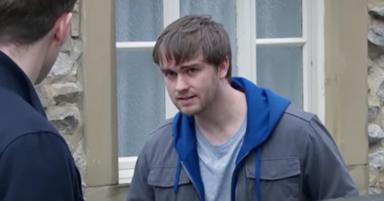 Emmerdale's Tom is talking to Belle's client outside