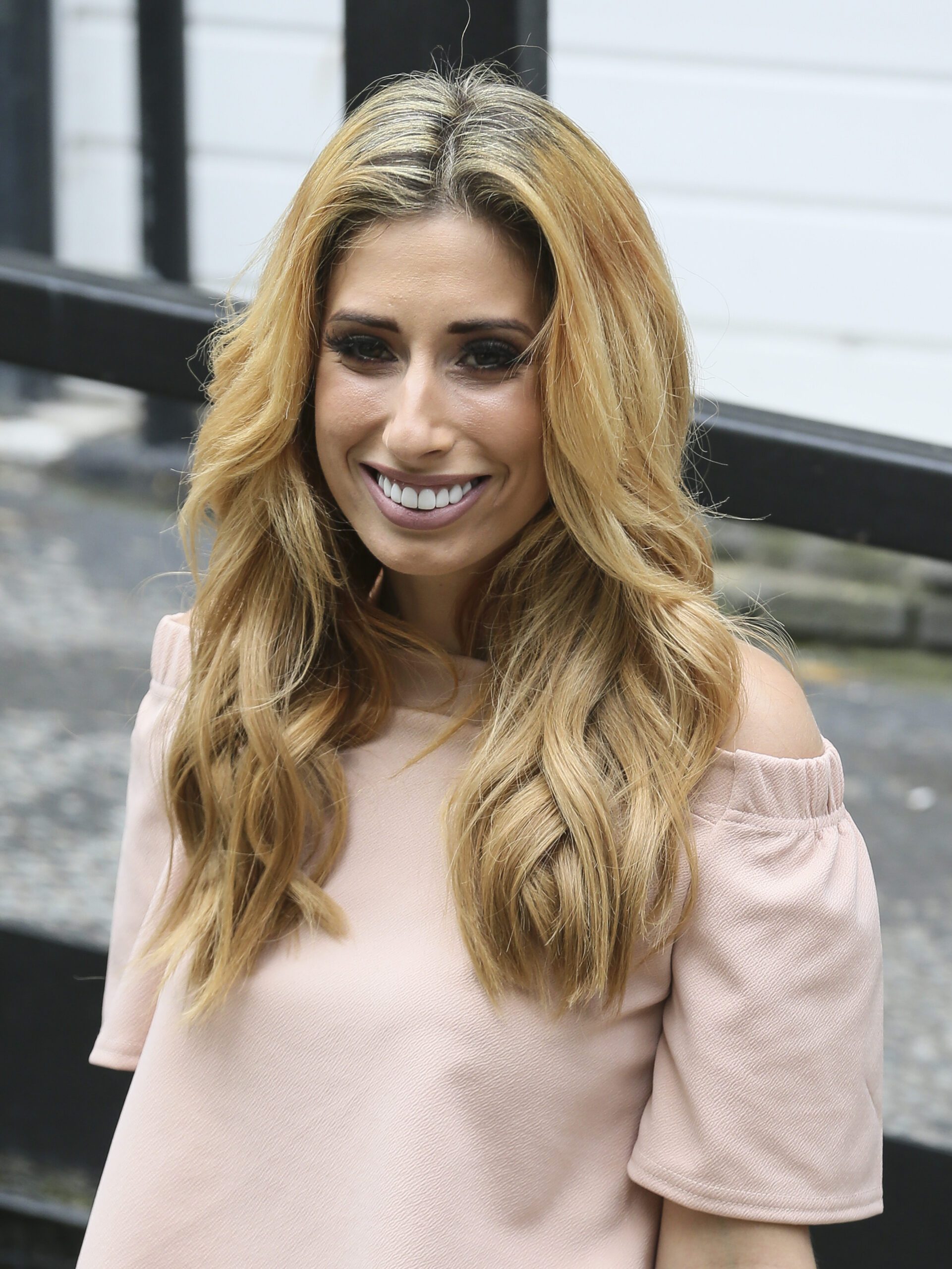 Stacey Solomon wearing a nude top smiling