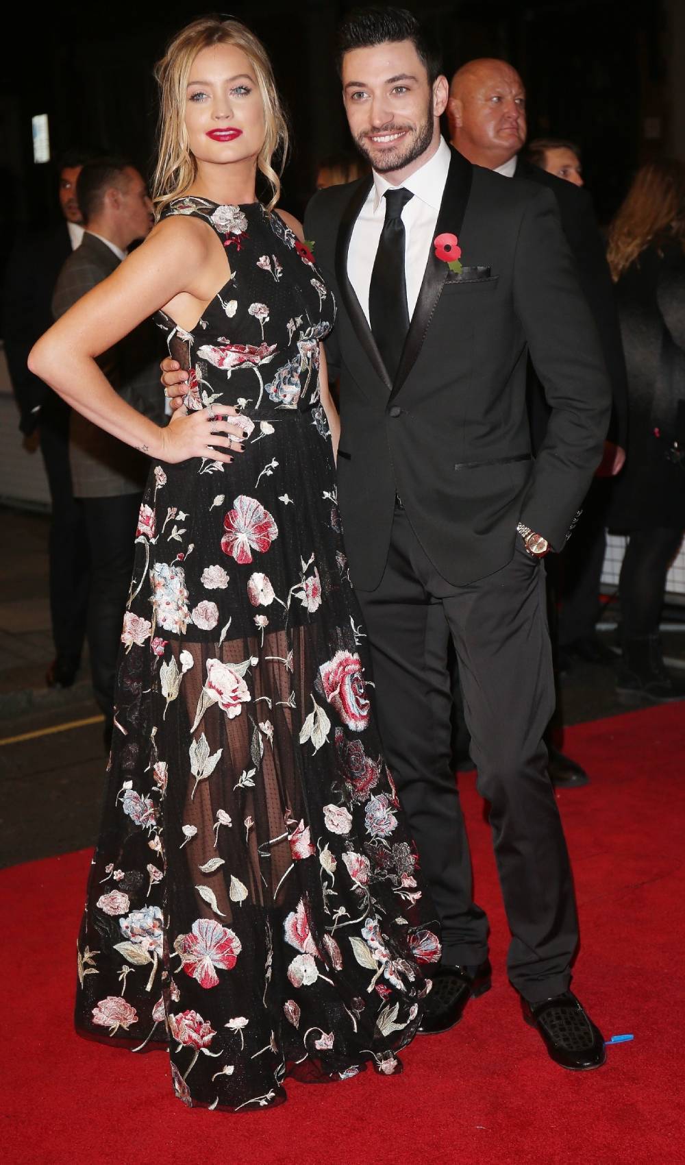 Laura Whitmore and Giovanni Pernice pose for pictures