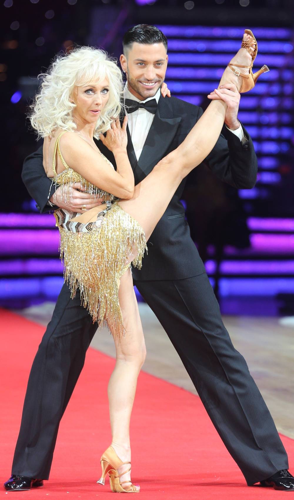 Giovanni Pernice holds the ankle of ex Strictly partner Debbie McGee