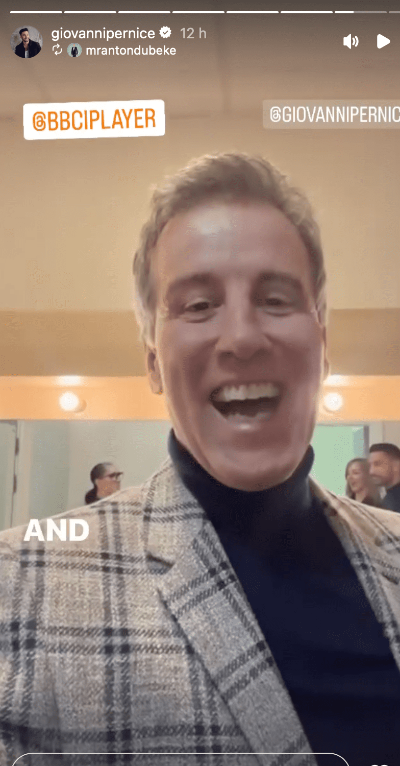 Anton Du Beke smiling as he supports Giovanni Pernice backstage at his live show