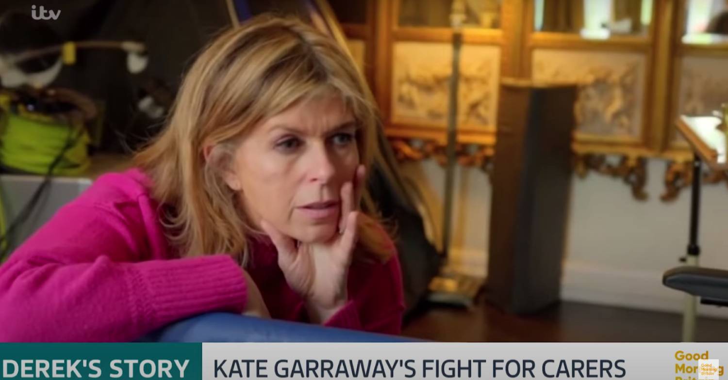 Kate Garraway rests her face in her hand