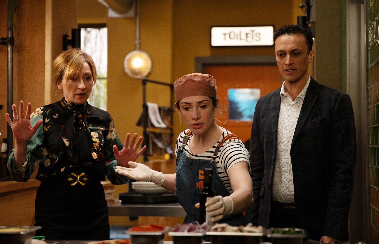 Emmerdale: Laurel puts her hands up as Victoria looks worried and Jai confused