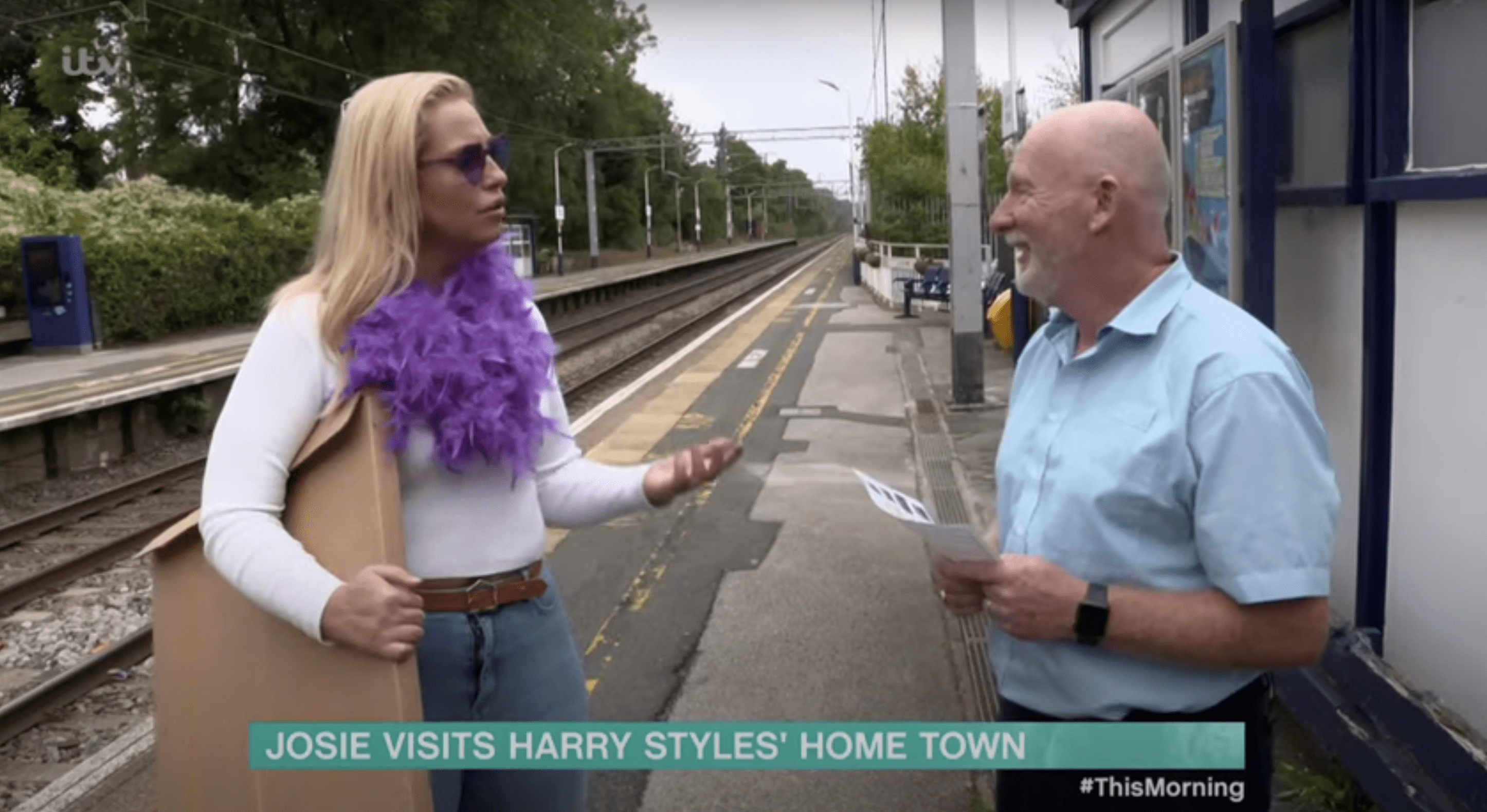 This Morning presenter Josie Gibson wearing feather scarf at train station 