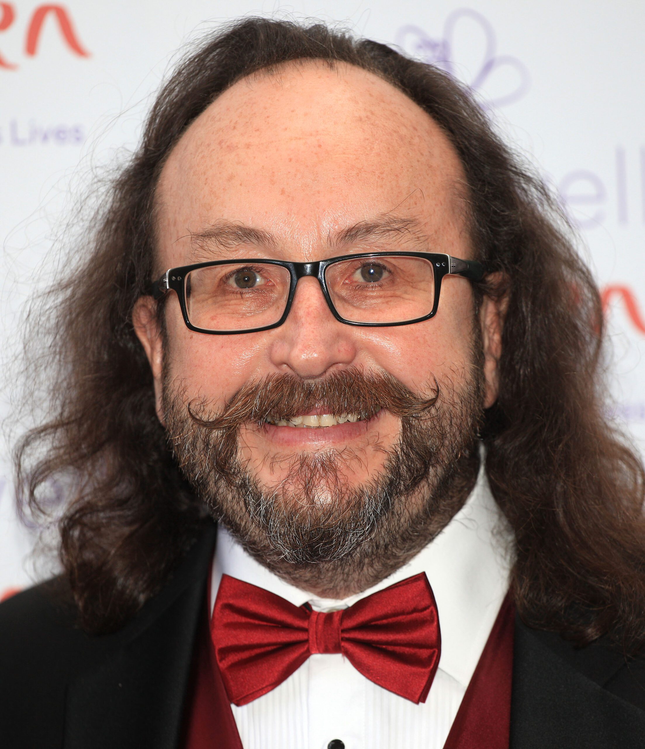 Dave Myers smiling wearing a tuxedo