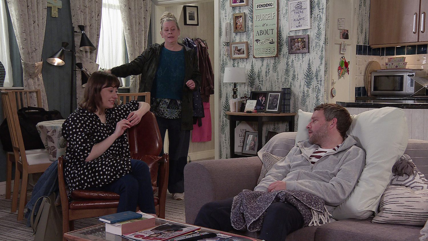 Bernie in Coronation Street smiles as she sees Hannah and Paul interacting