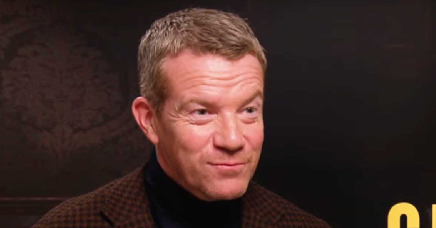 Max Beesley smirking during an interview 