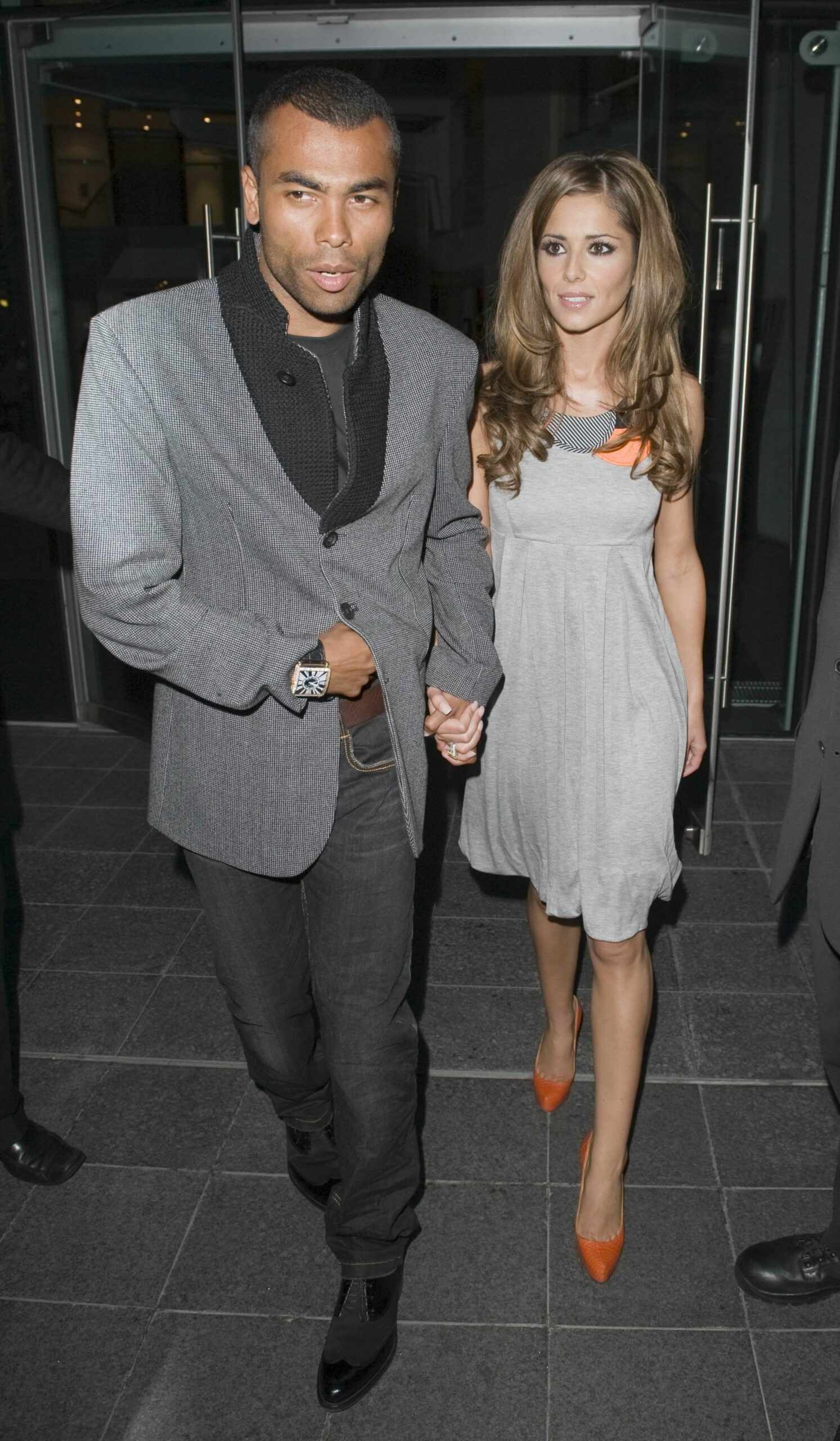Ashley Cole and Cheryl walking 