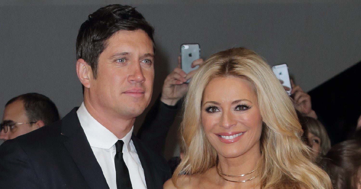 Vernon Kay smiling with Tess Daley