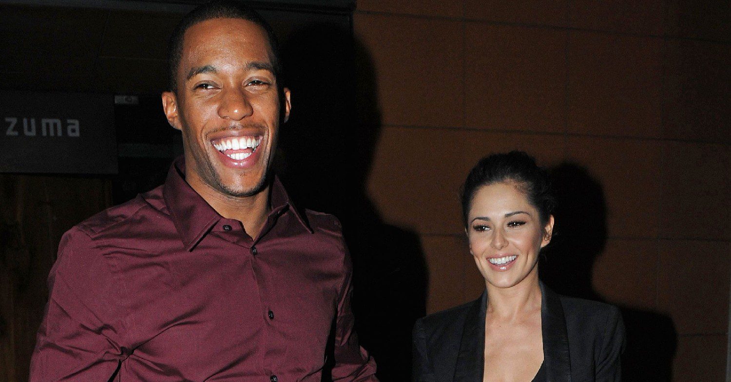 Tre Holloway and Cheryl laughing while out on a walk at night