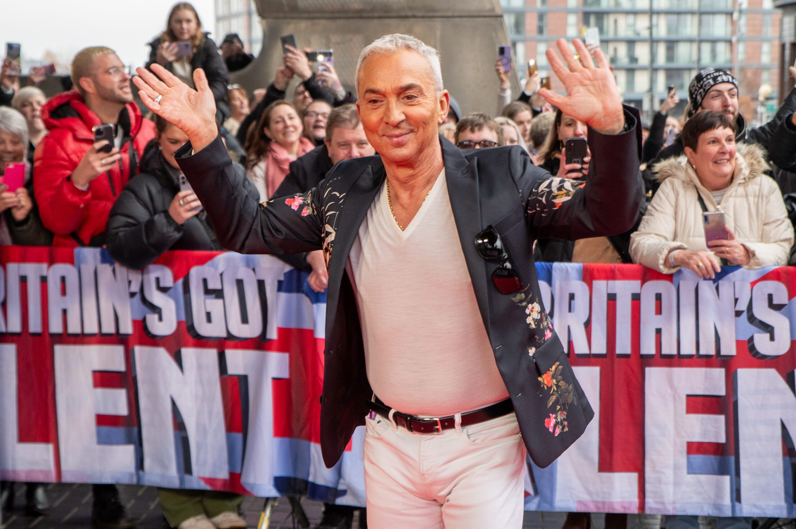 BGT 2024 judge Bruno Tonioli waving at the camera and smiling on the red carpet
