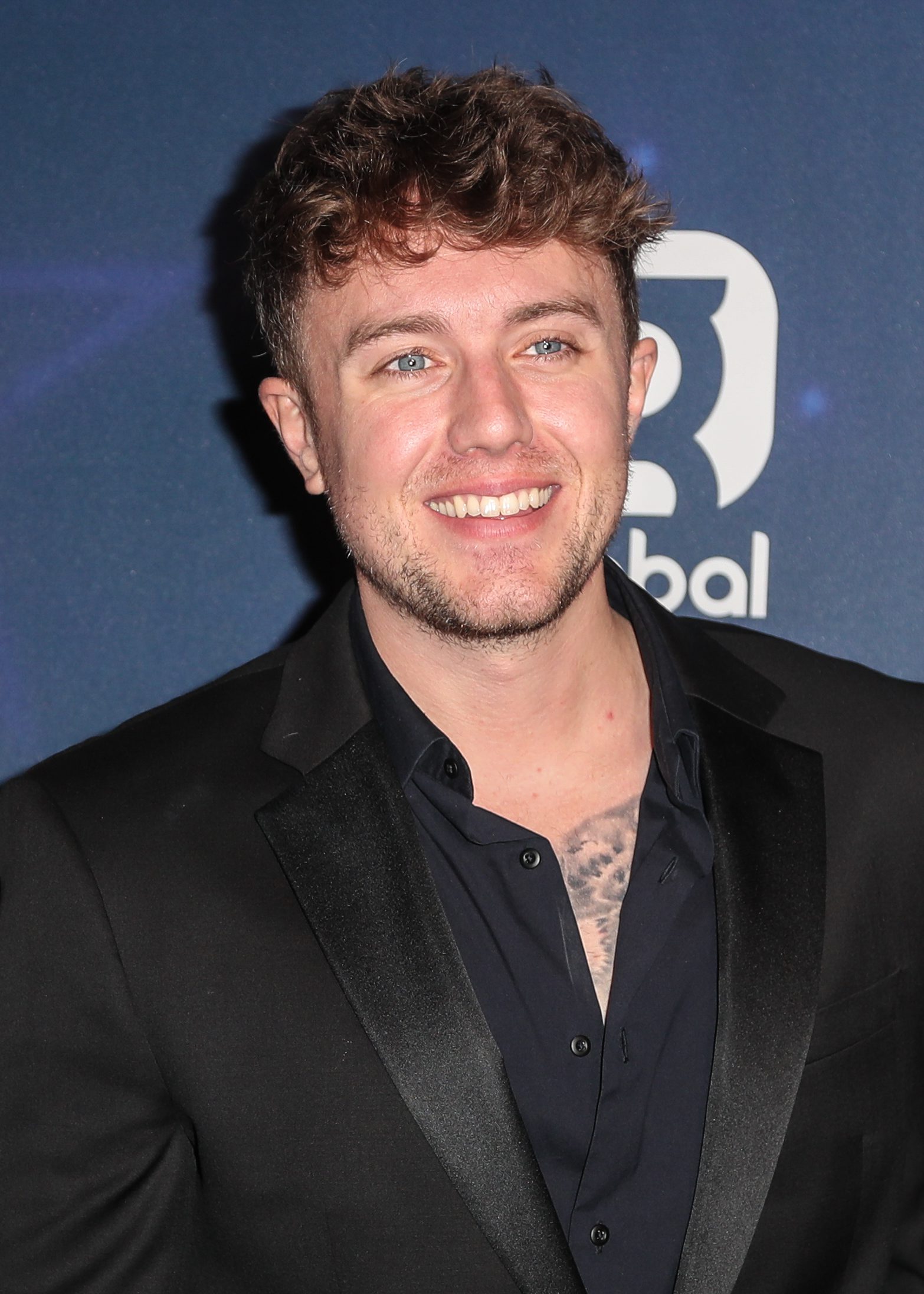 Roman Kemp could be in for Strictly stardom, Roman Kemp smiling whilst wearing an all black ensemble on the red carpet