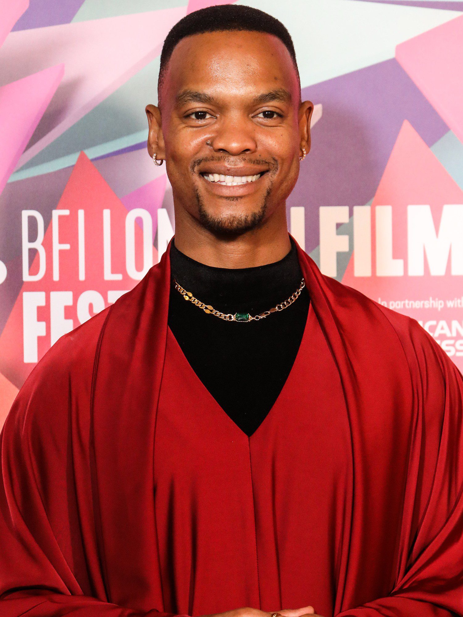 Strictly star Johannes Radebe smiling at event