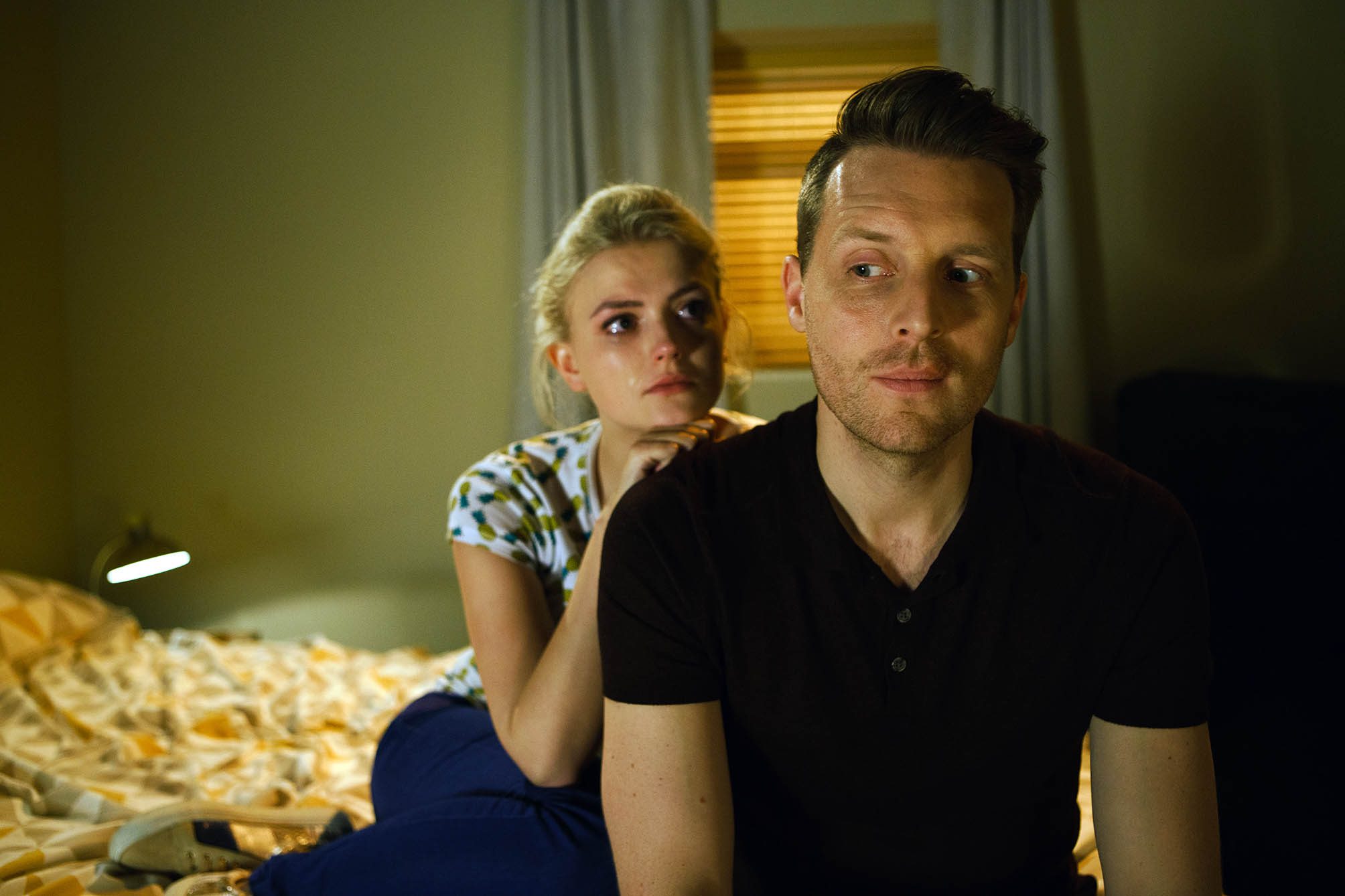 Coronation Street's Bethany Platt sits crying with her hand on evil Nathan Curtis' shoulder