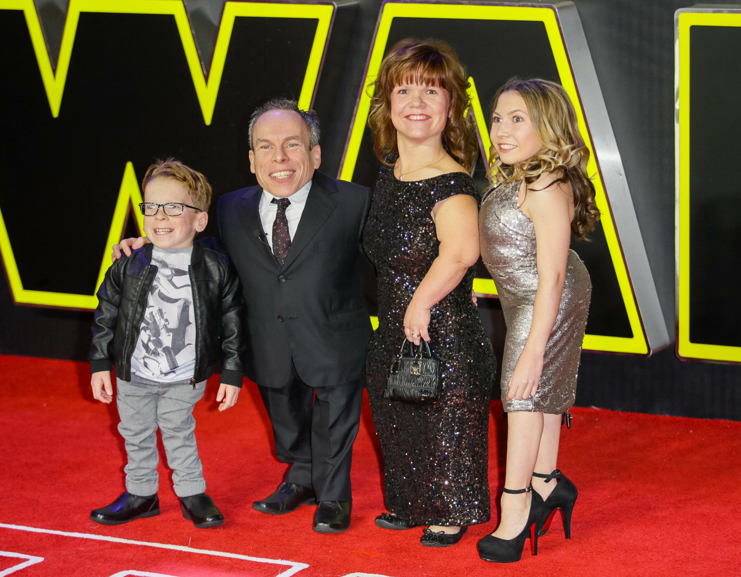 Warwick Davis and his family at a film premiere