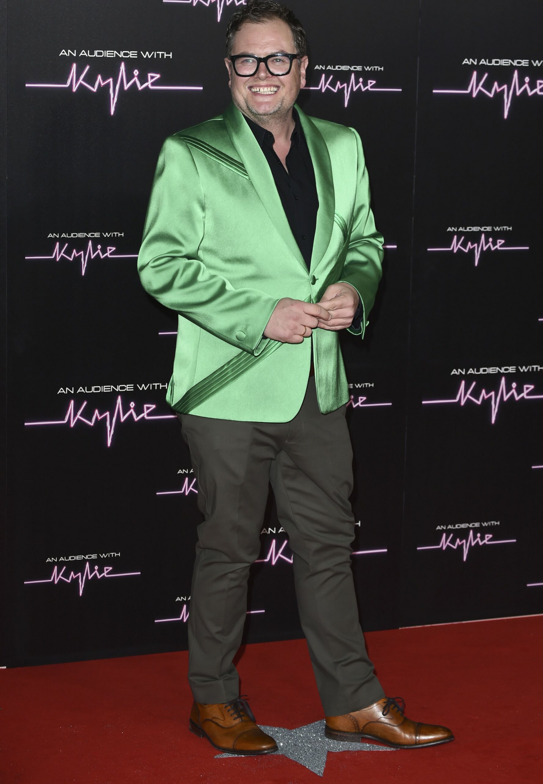 Alan Carr smiling at event