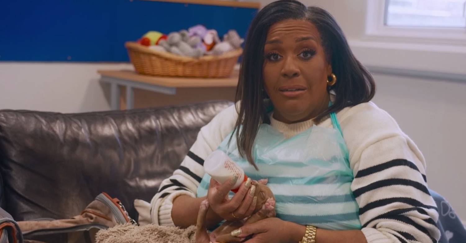 Alison Hammond cradles a puppy